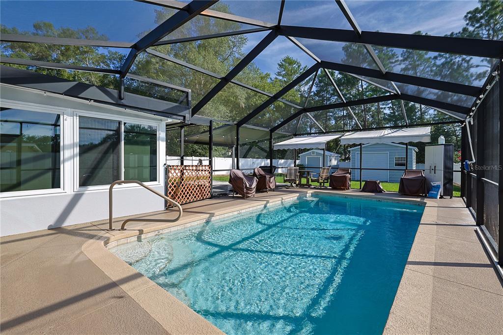 6367 Southwest 117th St Road Ocala, FL 34476 - Photo 31 of 43 a view of a backyard with sitting area