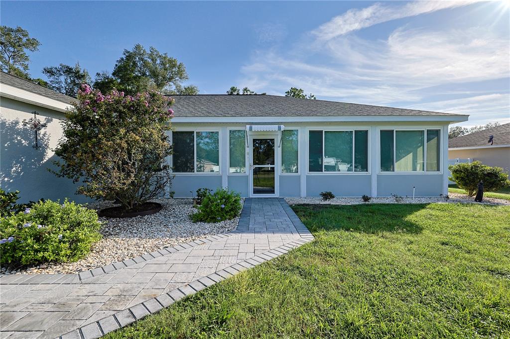 6367 Southwest 117th St Road Ocala, FL 34476 - Photo 4 of 43 front view of a house with a yard