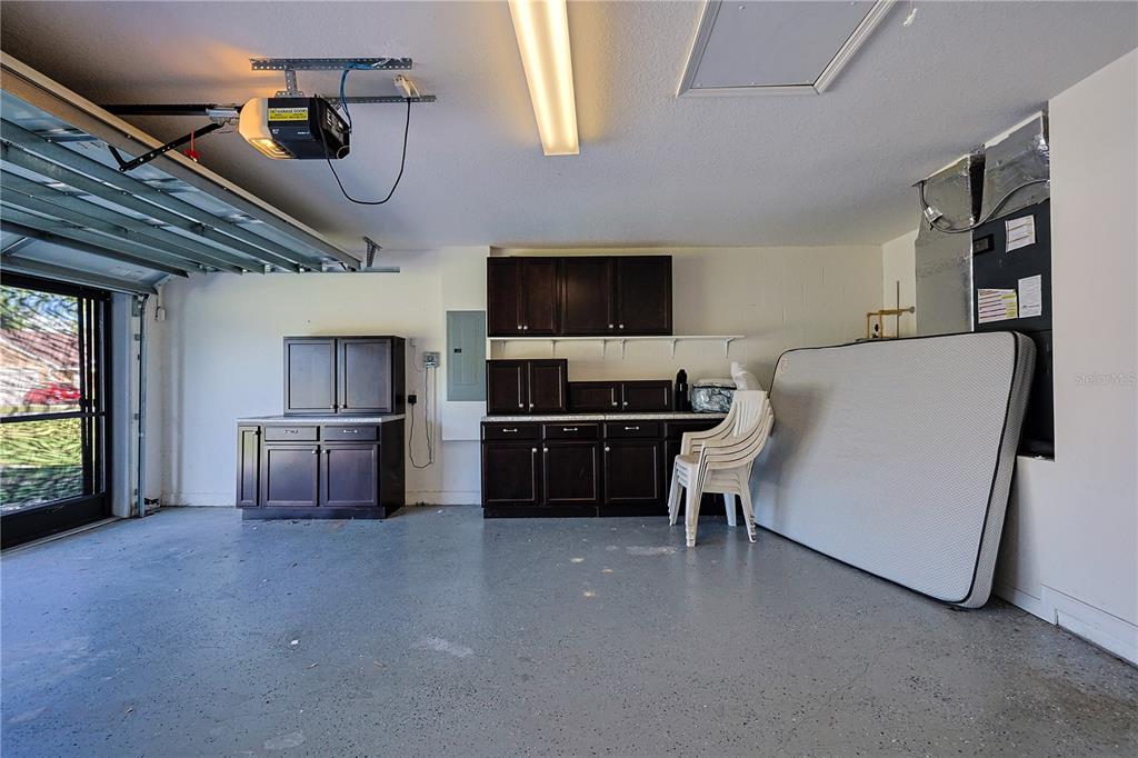 6367 Southwest 117th St Road Ocala, FL 34476 - Photo 42 of 43 a living room with furniture and a flat screen tv
