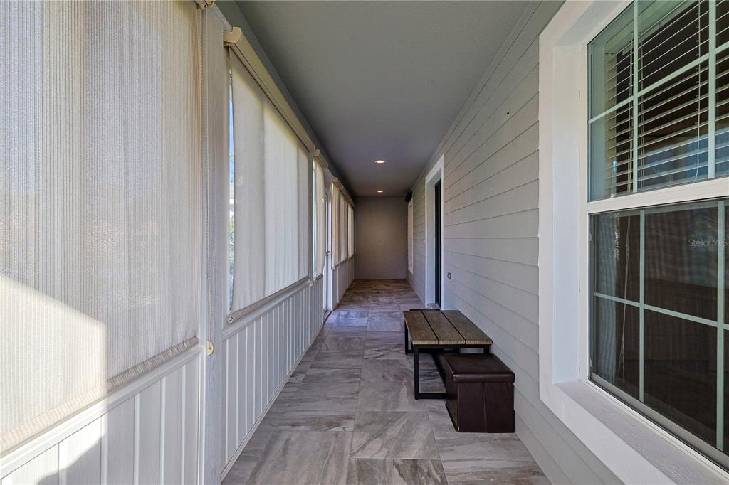 6367 Southwest 117th St Road Ocala, FL 34476 - Photo 7 of 43 a view of a hallway with wooden floor and staircase