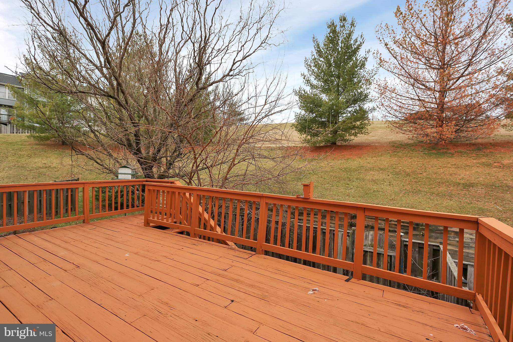 5588 Rivendell Place Frederick, MD 21703 - Photo 8 of 24 Deck with steps to fenced yard