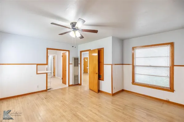 a view of an empty room with a window