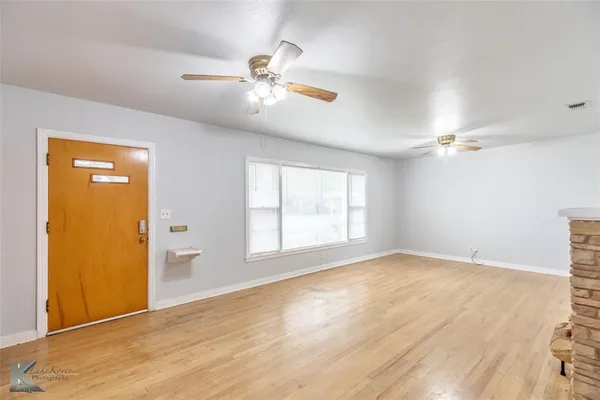 a view of an empty room with a window