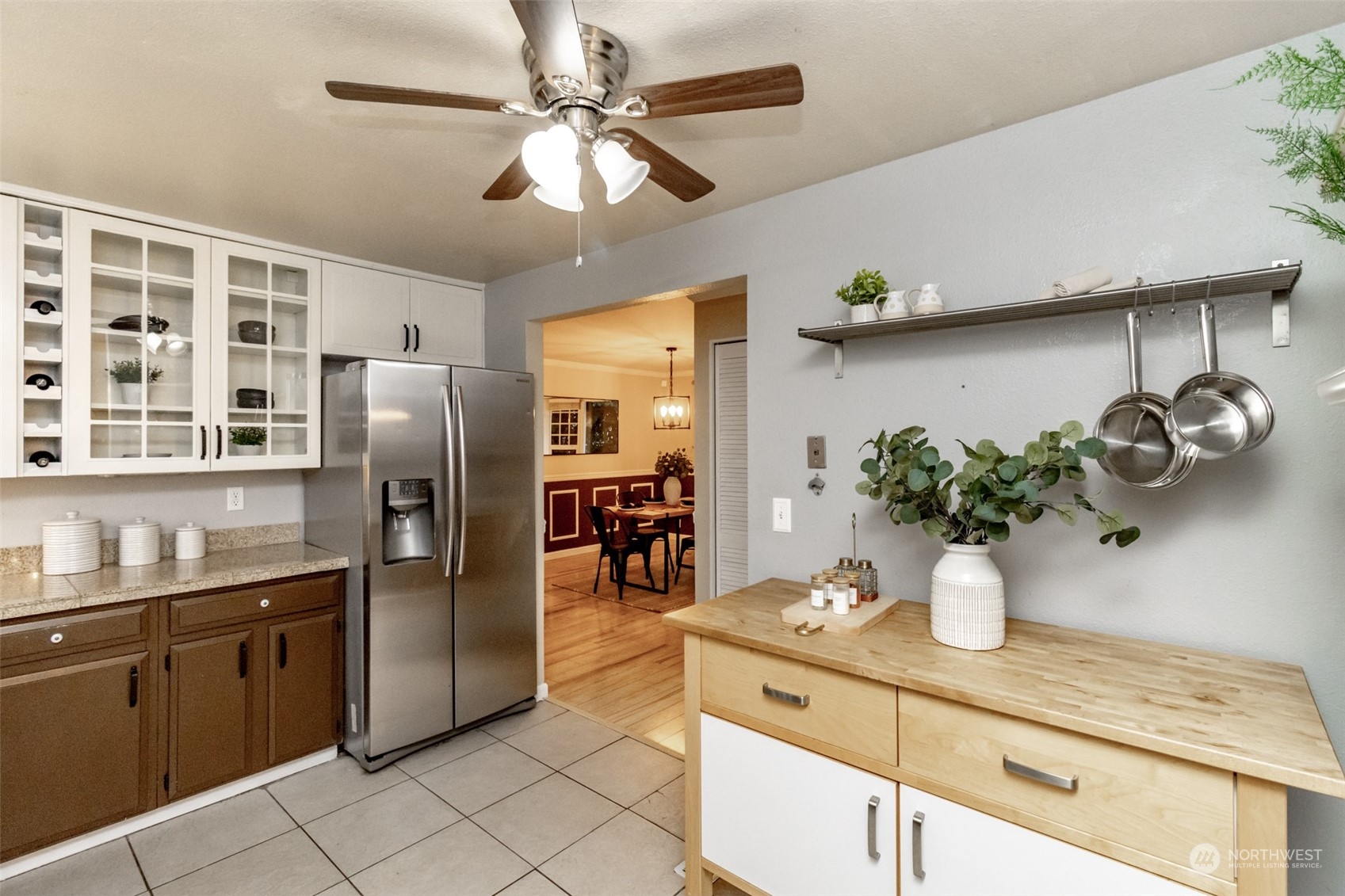 15602 Southeast 178th Street Renton, WA 98058 - Photo 11 of 29 a kitchen with stainless steel appliances granite countertop a sink a counter space and cabinets