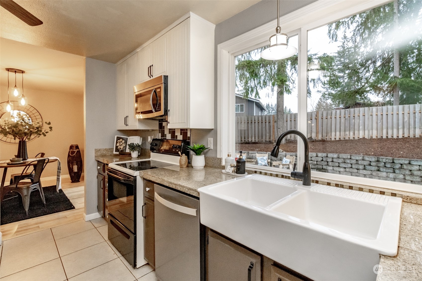 15602 Southeast 178th Street Renton, WA 98058 - Photo 12 of 29 a kitchen with a sink and a stove top oven