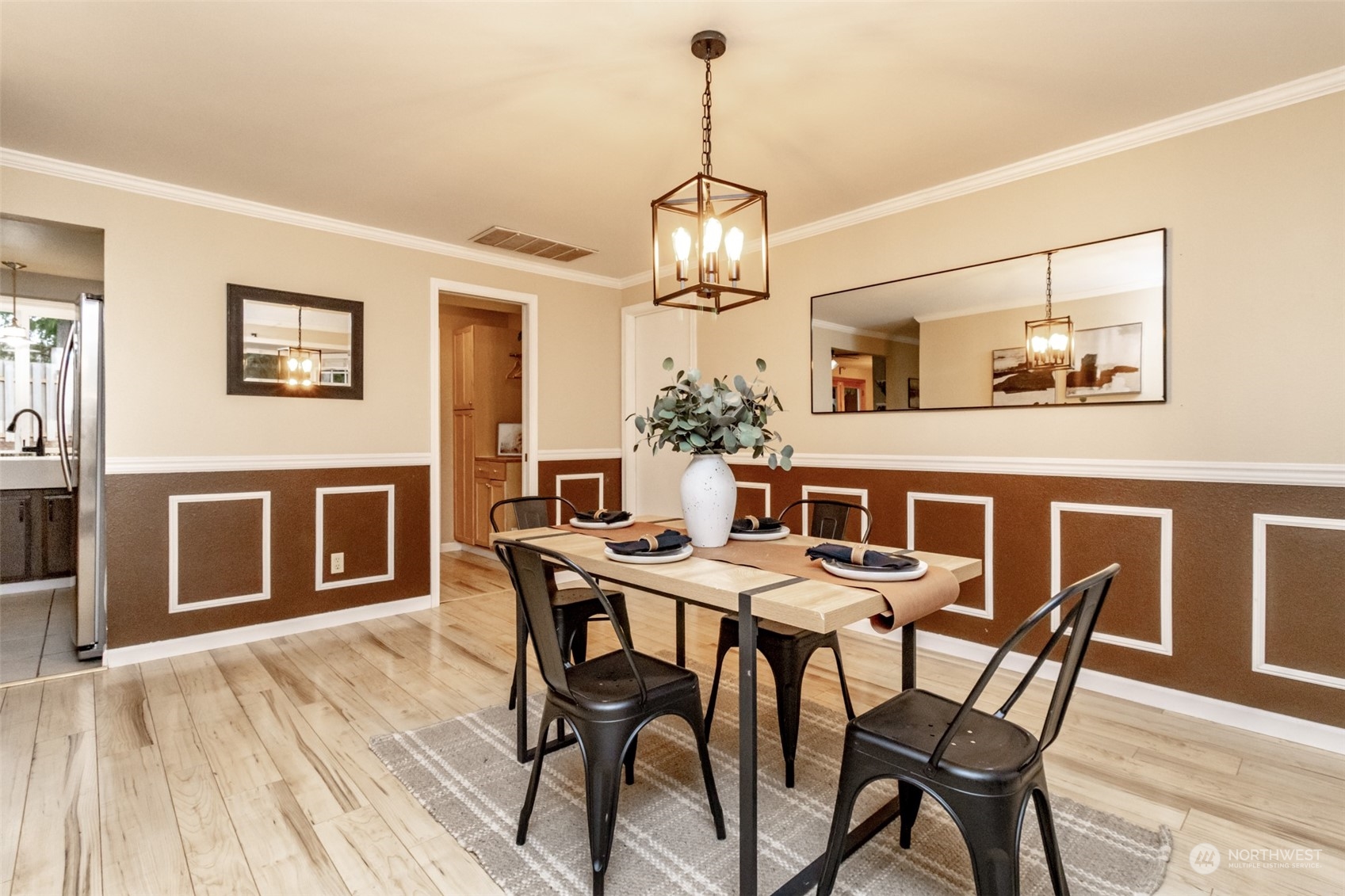 15602 Southeast 178th Street Renton, WA 98058 - Photo 13 of 29 a view of a dining room with furniture wooden floor and chandelier