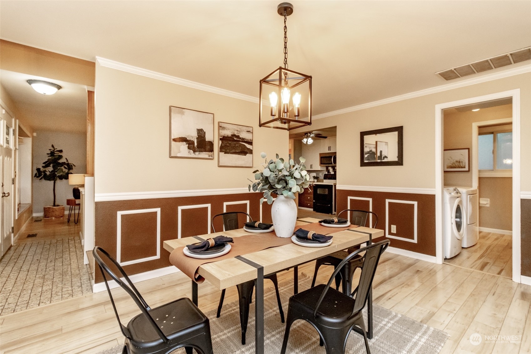 15602 Southeast 178th Street Renton, WA 98058 - Photo 14 of 29 a view of a dining room with furniture wooden floor and chandelier
