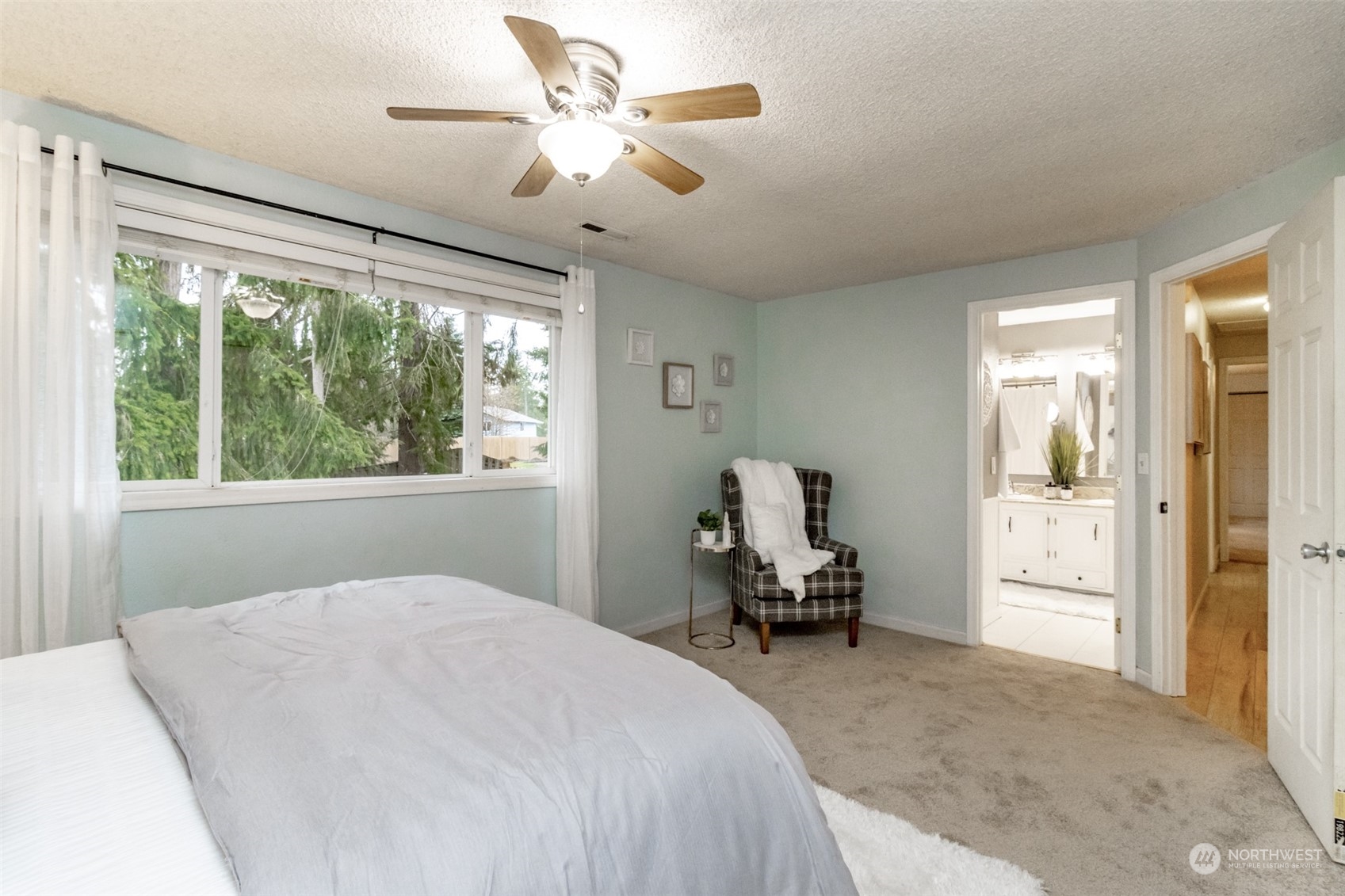 15602 Southeast 178th Street Renton, WA 98058 - Photo 23 of 29 a bedroom with a bed and a large window