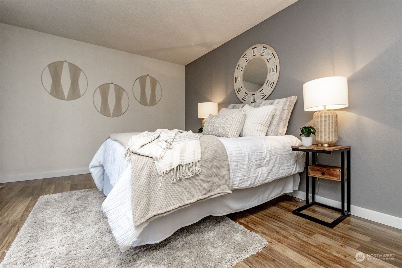 15602 Southeast 178th Street Renton, WA 98058 - Photo 26 of 29 a bedroom with a bed and wooden floor