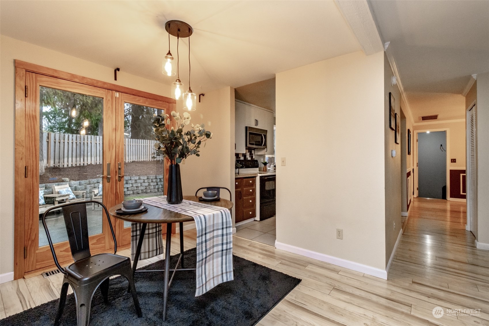 15602 Southeast 178th Street Renton, WA 98058 - Photo 10 of 29 a view of a dining room with furniture window and wooden floor