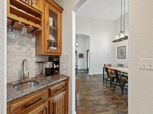 a kitchen with refrigerator and cabinets