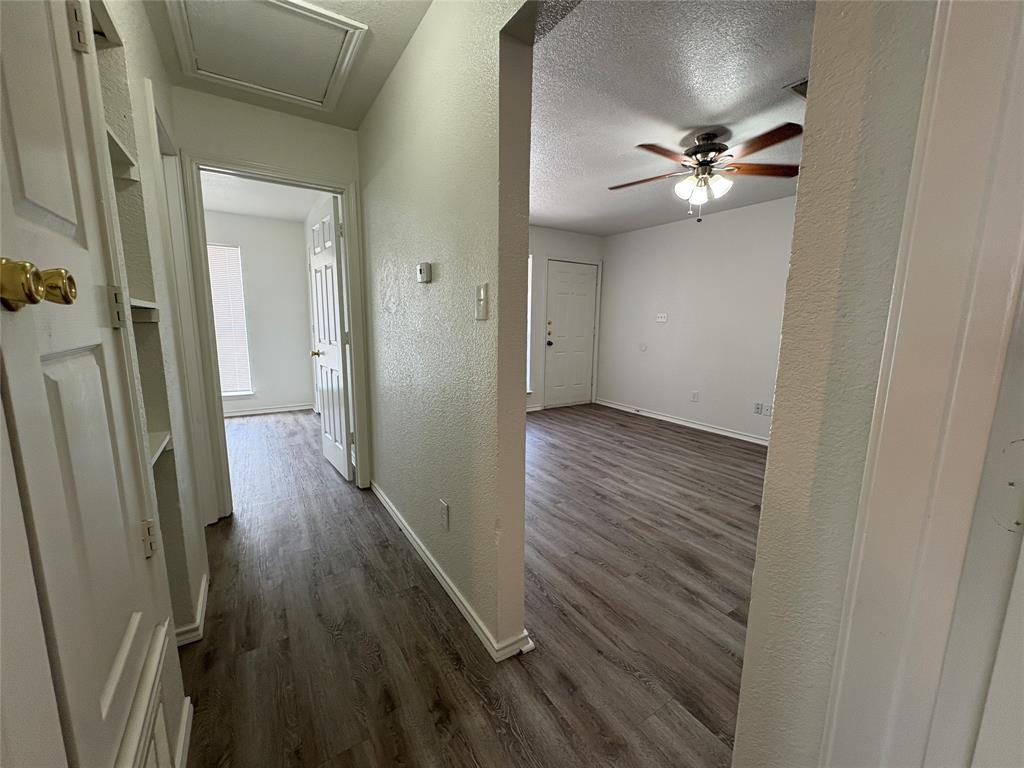 404 South Anglin Street, Unit B Cleburne, TX 76031 - Photo 7 of 12 a view of a hallway with wooden floor