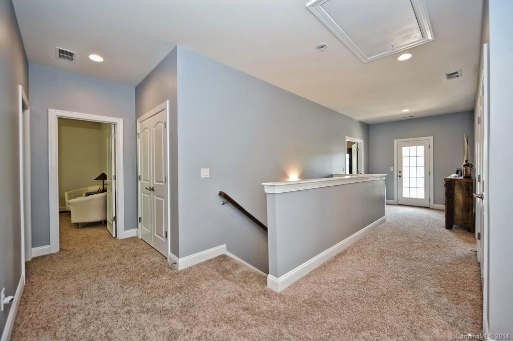 4002 Fallondale Road Waxhaw, NC 28173 - Photo 14 of 24 wooden floor in an empty room with a kitchen