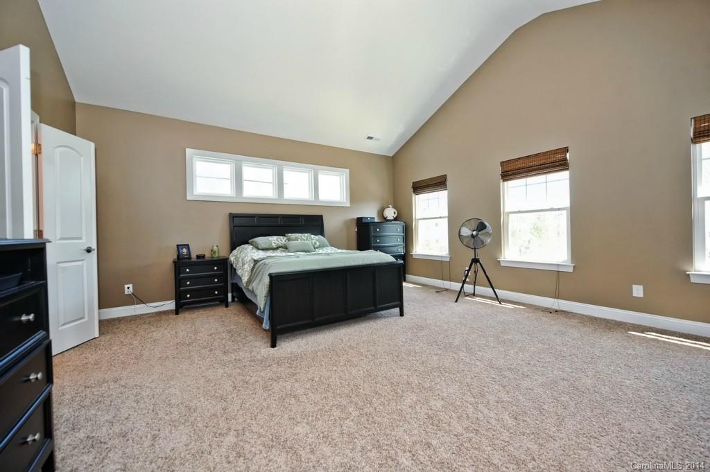 4002 Fallondale Road Waxhaw, NC 28173 - Photo 15 of 24 a spacious bedroom with a bed and a window