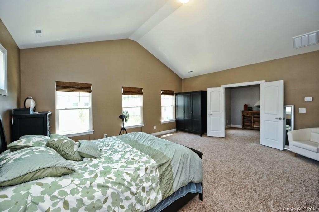 4002 Fallondale Road Waxhaw, NC 28173 - Photo 16 of 24 a bedroom with a bed and a large mirror