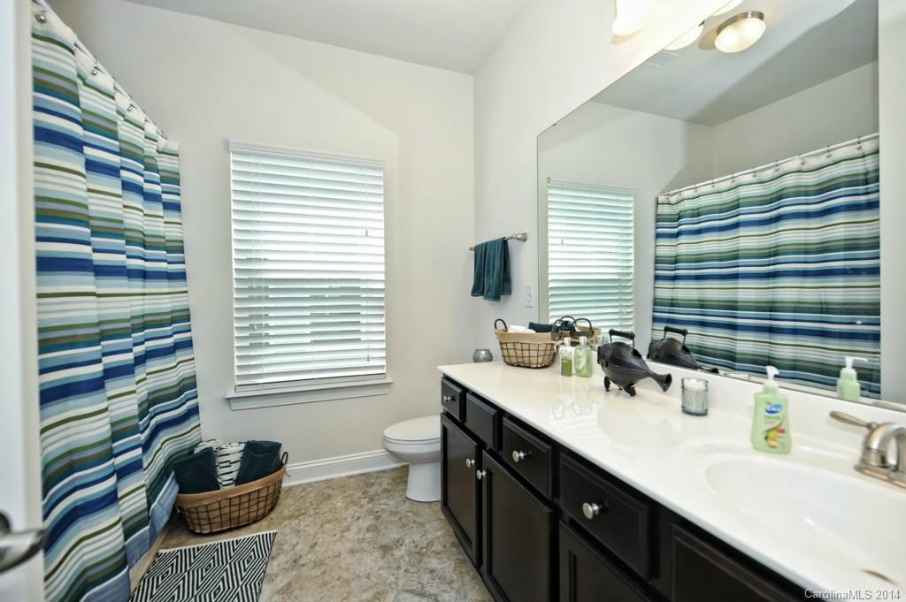 4002 Fallondale Road Waxhaw, NC 28173 - Photo 21 of 24 a bathroom with double vanity and a mirror