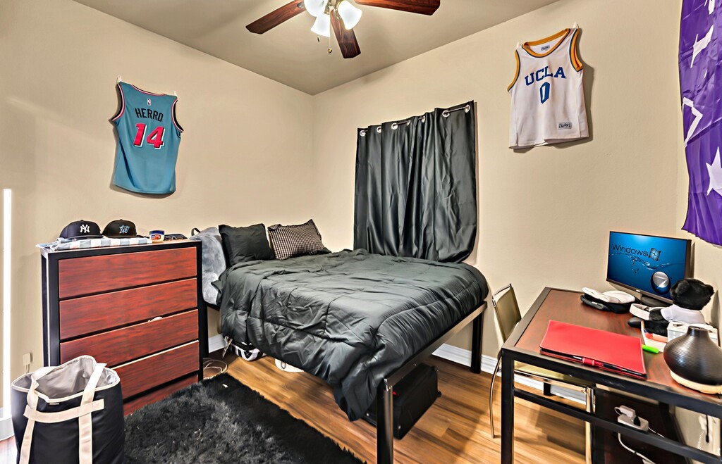 2410 2nd Street South, Unit 1056 Waco, TX 76706 - Photo 17 of 37 a bedroom with a bed and cabinets