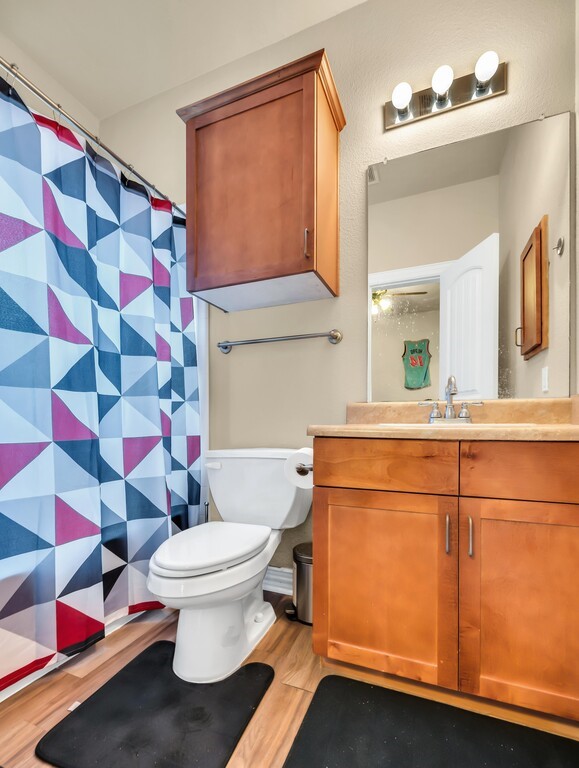 2410 2nd Street South, Unit 1056 Waco, TX 76706 - Photo 19 of 37 a bathroom with a sink toilet and shower