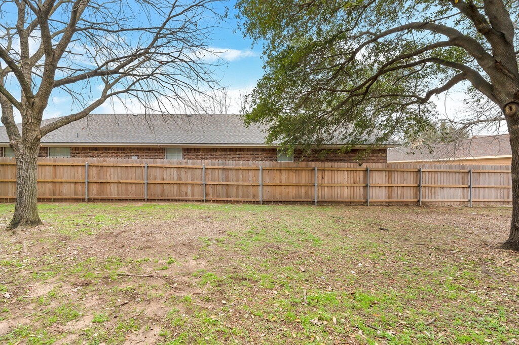 2410 2nd Street South, Unit 1056 Waco, TX 76706 - Photo 26 of 37 a view of backyard and tree