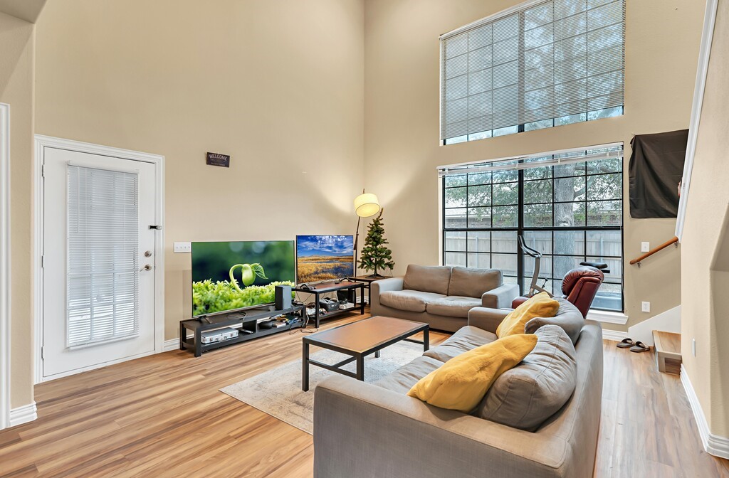 2410 2nd Street South, Unit 1056 Waco, TX 76706 - Photo 5 of 37 a living room with furniture and a flat screen tv