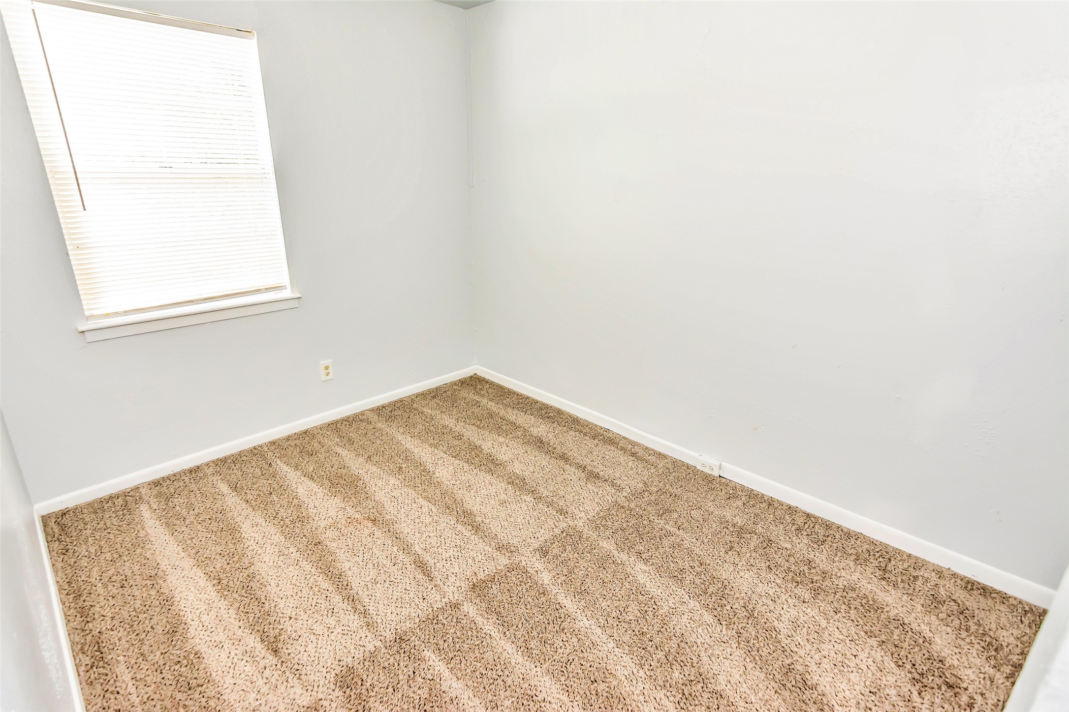 9706 Farragut Street Houston, TX 77078 - Photo 8 of 12 a view of a small space with wooden floor and a window