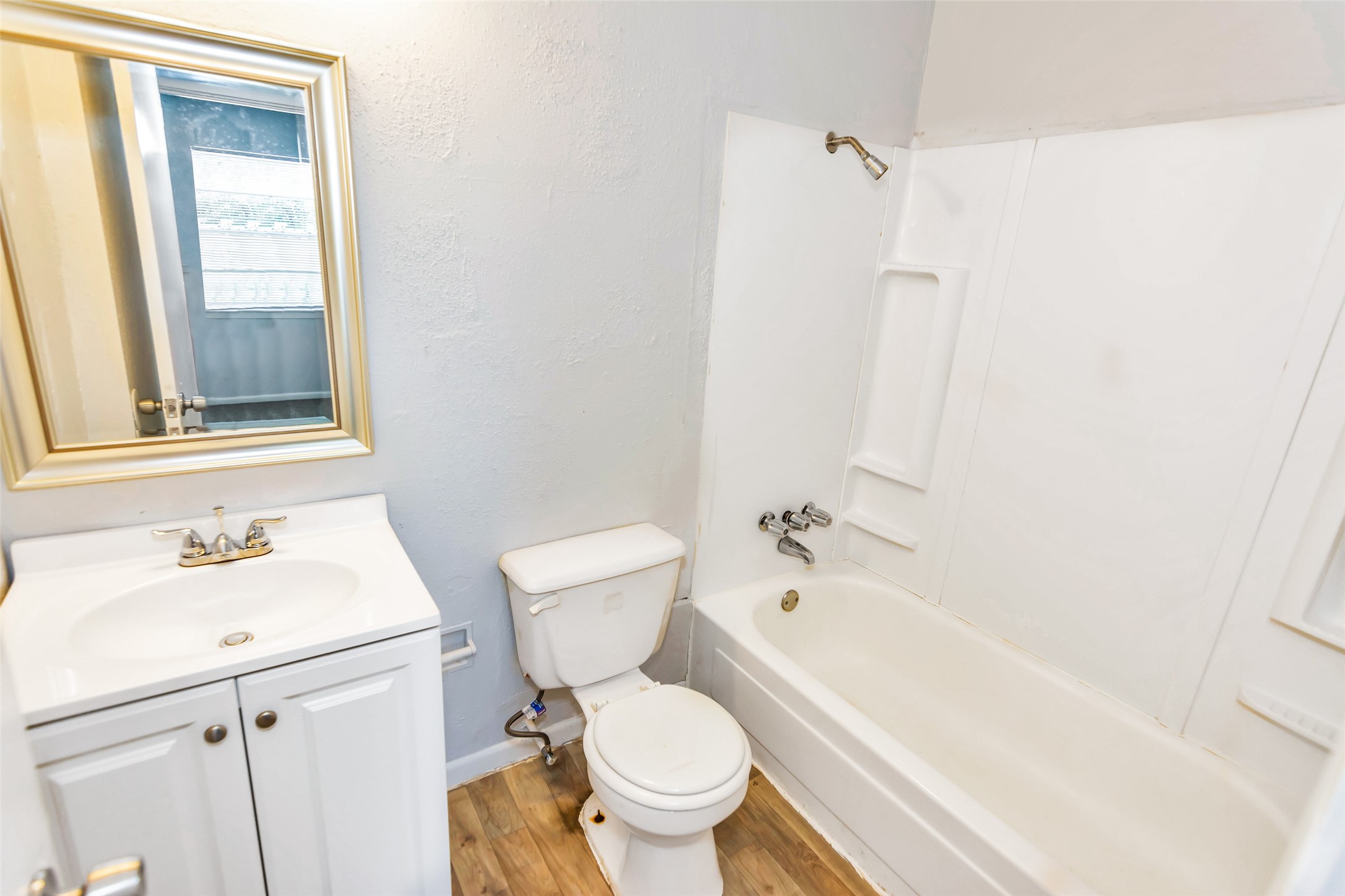 9706 Farragut Street Houston, TX 77078 - Photo 9 of 12 a bathroom with a sink toilet and shower