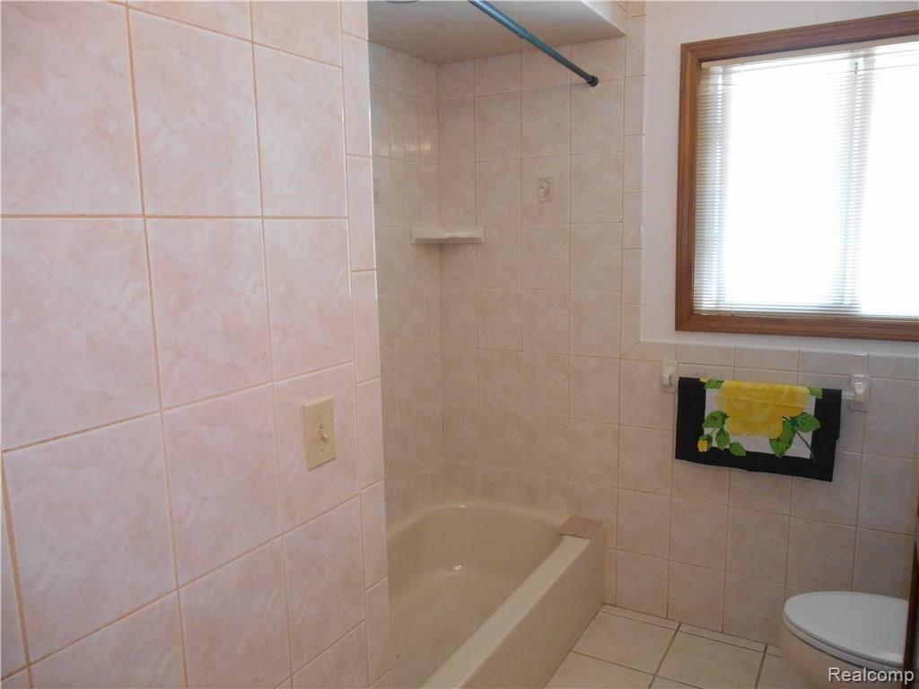 25754 Peter Kaltz Road Warren, MI 48091 - Photo 37 of 68 TILED SHOWER IN MAIN BATHROOM