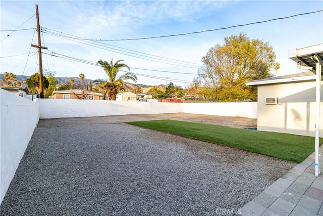 a view of a pathway both side of house