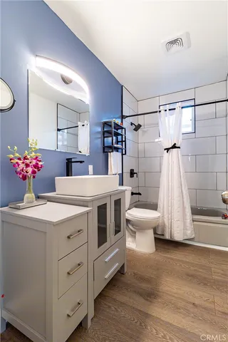 a kitchen with a sink and a refrigerator