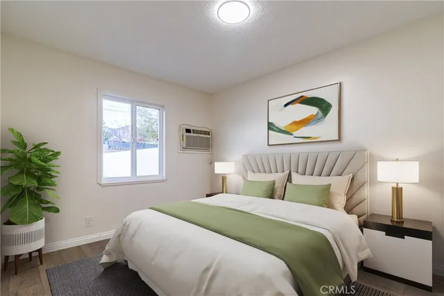 a bedroom with a bed and a potted plant