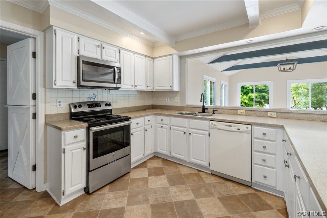561 Fords Road Manakin-Sabot, VA 23103 - Photo 11 of 33 a kitchen with white cabinets appliances and a window