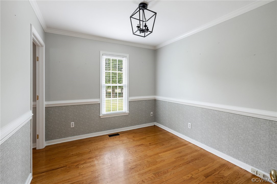 561 Fords Road Manakin-Sabot, VA 23103 - Photo 19 of 33 an empty room with wooden floor and windows