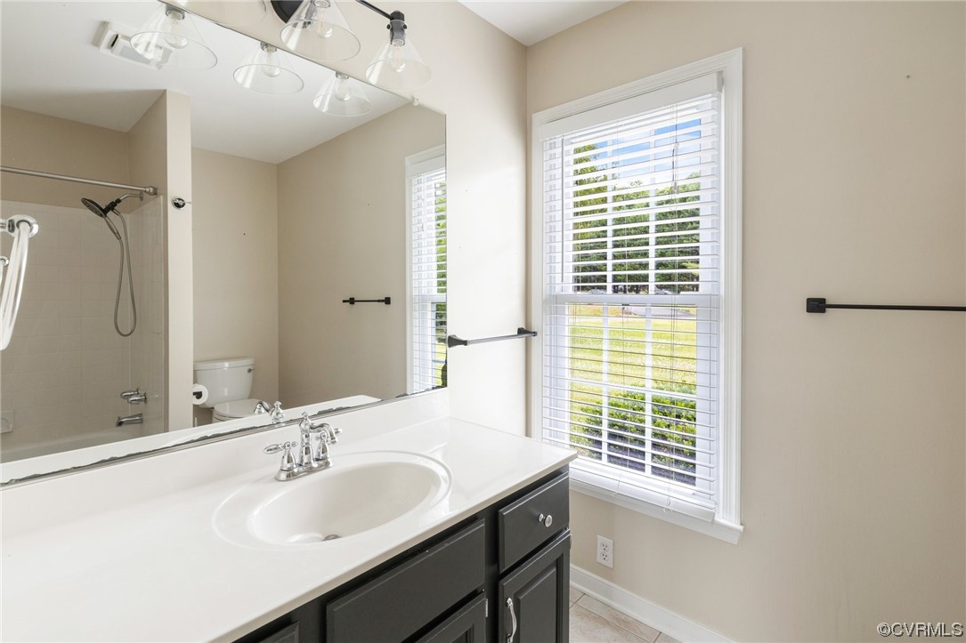 561 Fords Road Manakin-Sabot, VA 23103 - Photo 25 of 33 a bathroom with a granite countertop sink a shower and a mirror