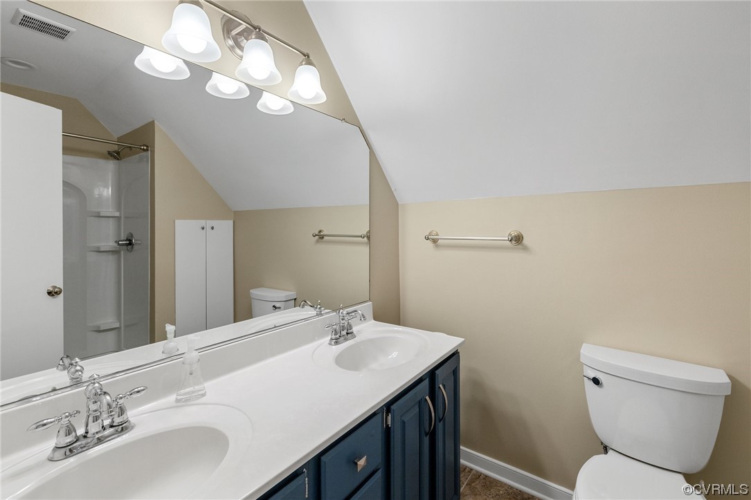 561 Fords Road Manakin-Sabot, VA 23103 - Photo 28 of 33 a bathroom with a sink a toilet and a mirror