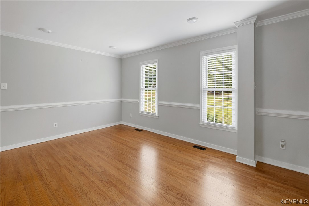 561 Fords Road Manakin-Sabot, VA 23103 - Photo 5 of 33 an empty room with wooden floor and windows