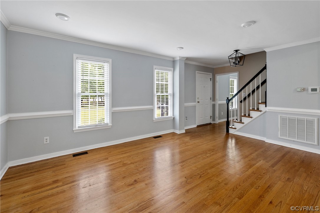 561 Fords Road Manakin-Sabot, VA 23103 - Photo 7 of 33 a view of an empty room with wooden floor and a window