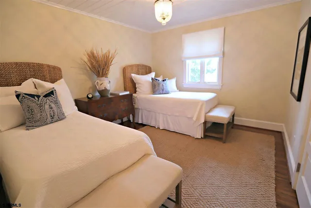 a bedroom with bed and a window