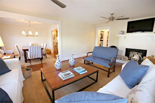 a living room with furniture fireplace and a flat screen tv