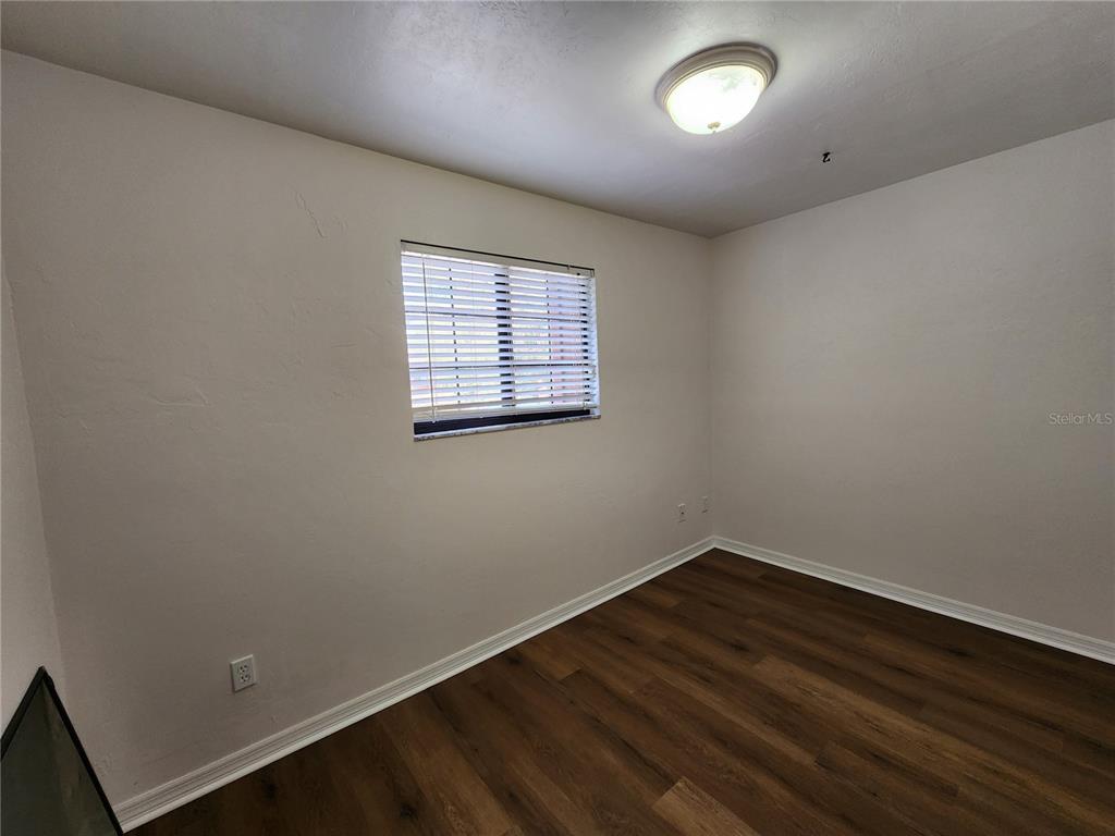 5823 Southwest 9th Place, Unit H55 Gainesville, FL 32607 - Photo 31 of 50 an empty room with a window