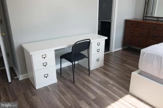 a bathroom with a sink vanity and a mirror