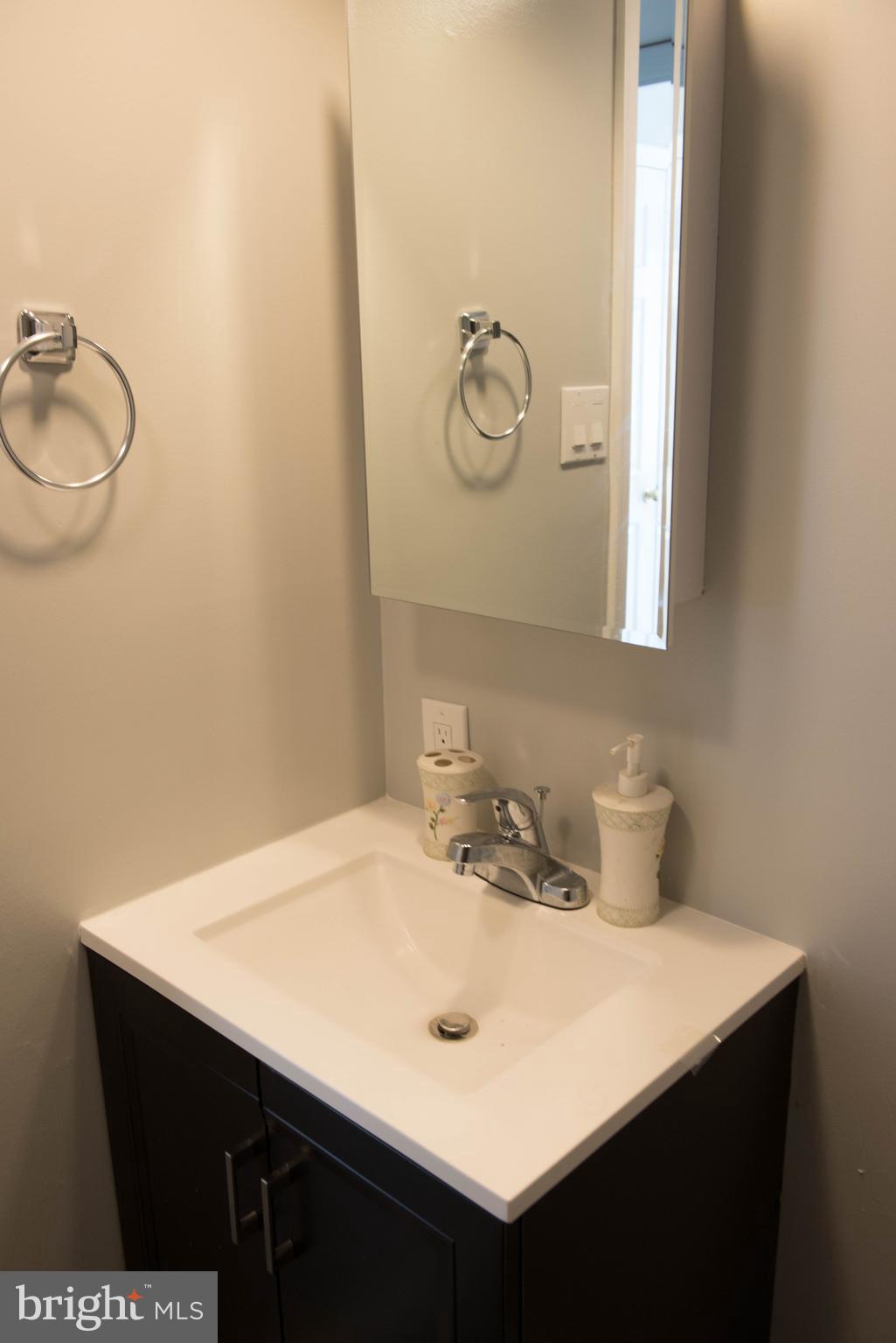 1301 North Courthouse Road, Unit 1507 Arlington, VA 22201 - Photo 26 of 35 a bathroom with a sink vanity and a mirror