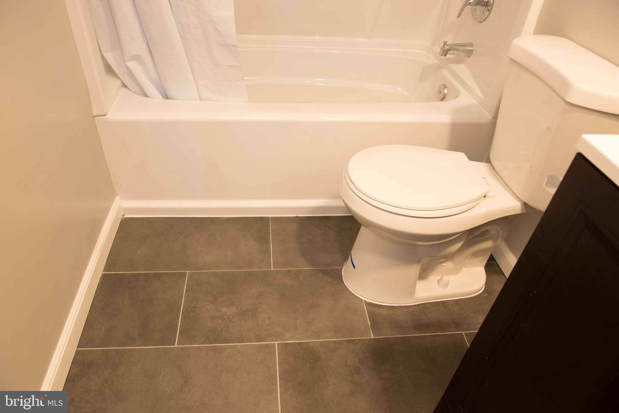 1301 North Courthouse Road, Unit 1507 Arlington, VA 22201 - Photo 28 of 35 a bathroom with a toilet and a shower