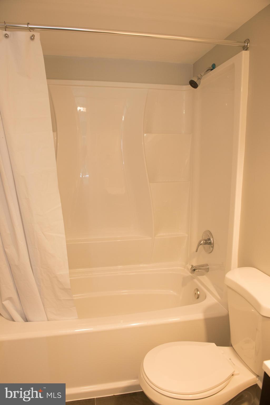 1301 North Courthouse Road, Unit 1507 Arlington, VA 22201 - Photo 31 of 35 a bathroom with a toilet and a shower