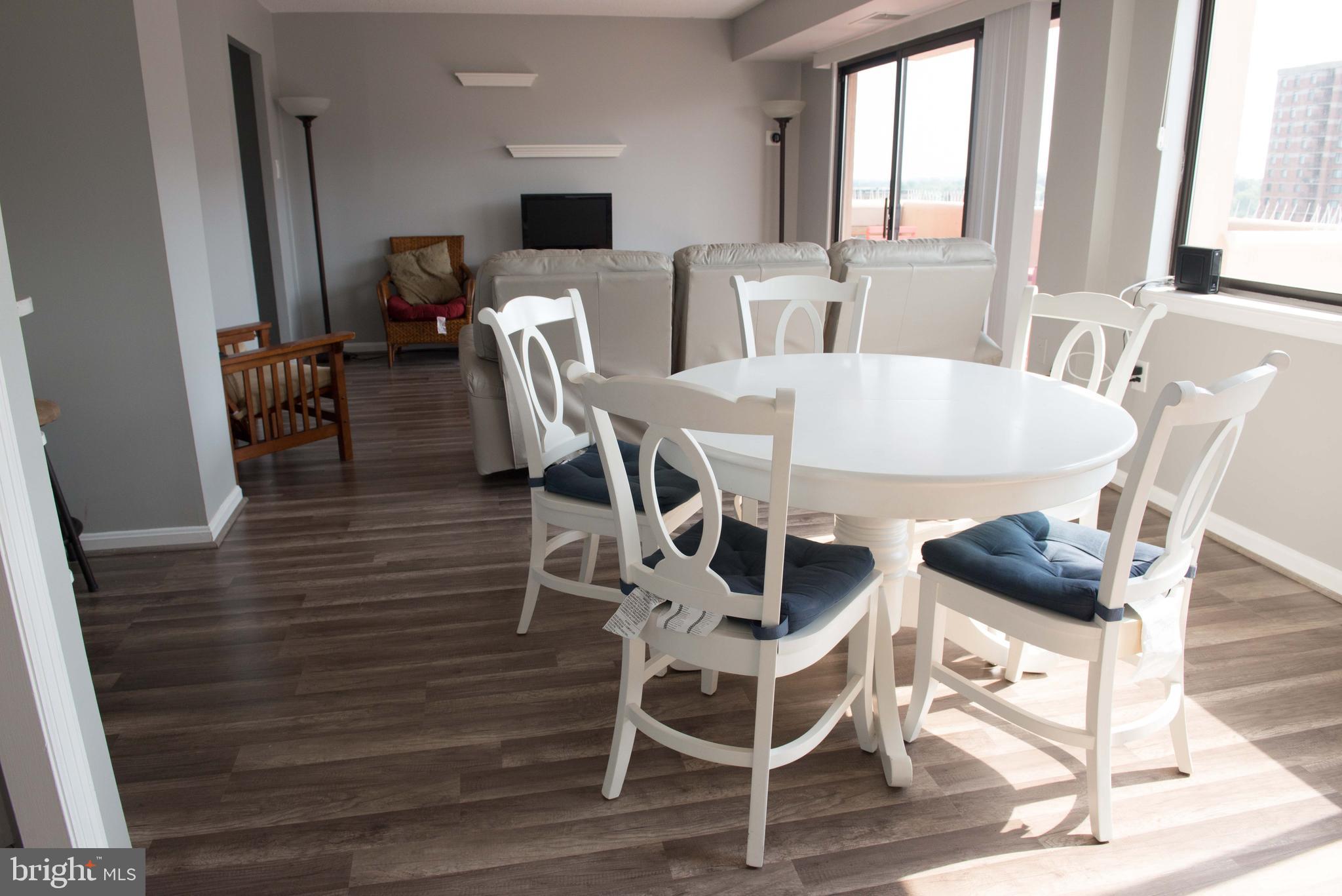 1301 North Courthouse Road, Unit 1507 Arlington, VA 22201 - Photo 5 of 35 a view of a dining room with furniture and wooden floor