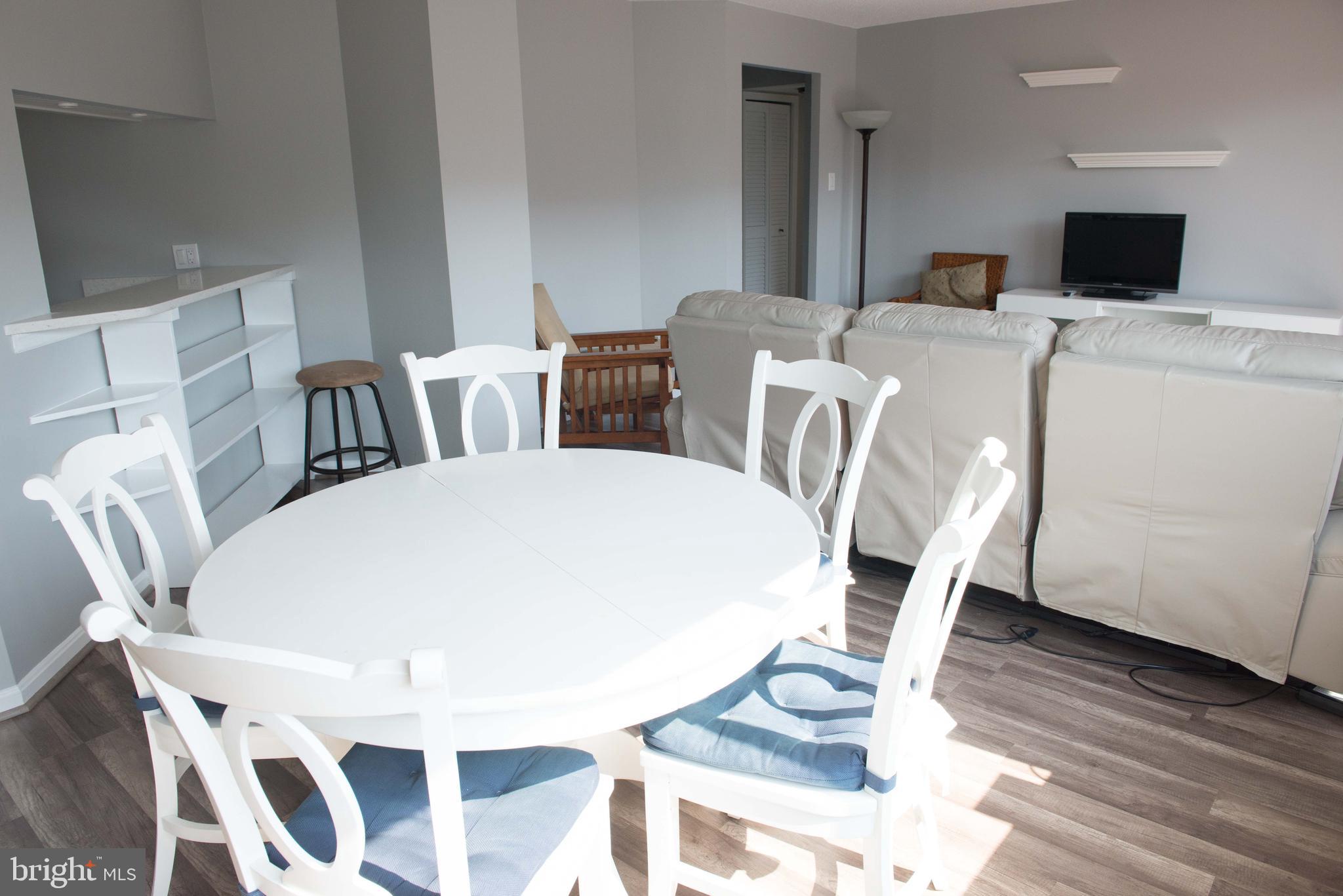 1301 North Courthouse Road, Unit 1507 Arlington, VA 22201 - Photo 6 of 35 a view of a dining room with furniture