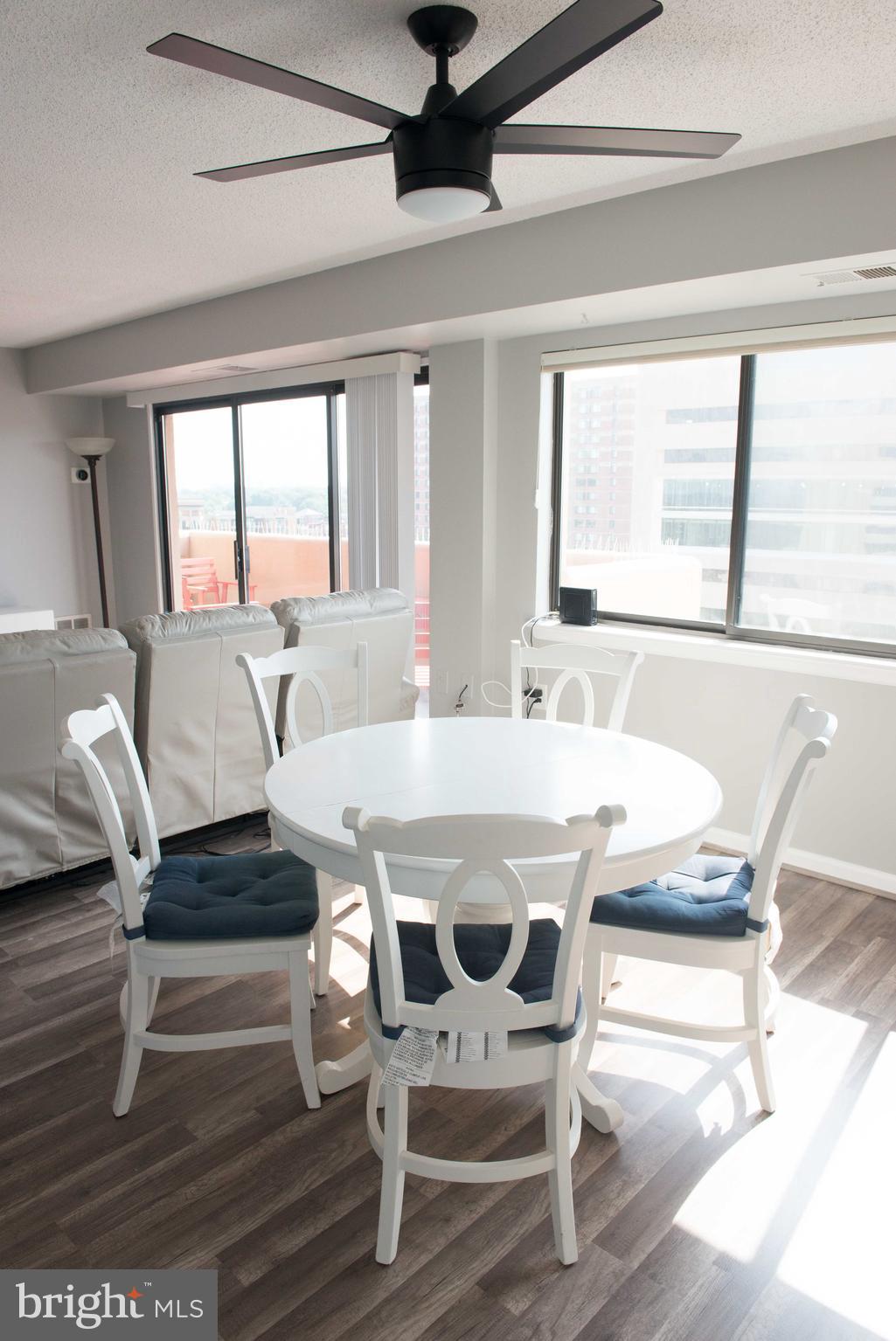 1301 North Courthouse Road, Unit 1507 Arlington, VA 22201 - Photo 7 of 35 a view of a dining room with furniture window and outside view