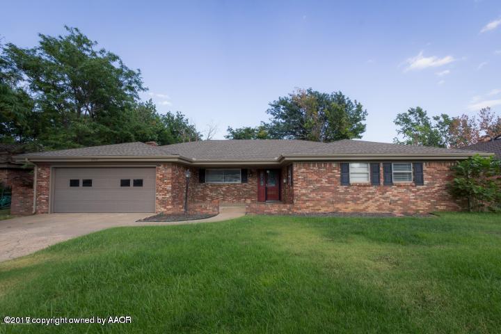 3313 Lombard Road Amarillo, TX 79106 - Photo 1 of 20 a front view of a house with a yard and garage