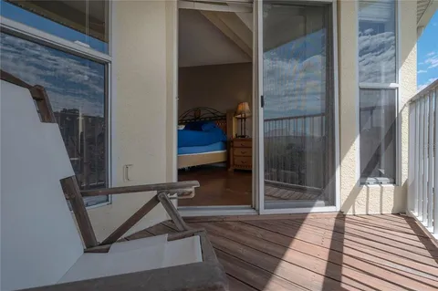 a bedroom with a bed and a potted plant