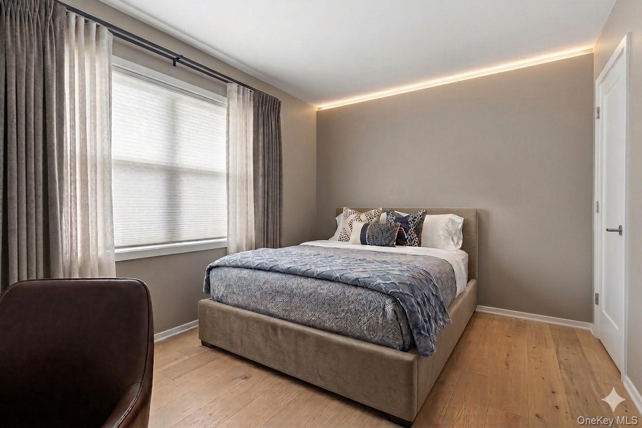 20 Old Farm Road Scarsdale, NY 10583 - Photo 18 of 27 a bed sitting in a bedroom next to a window