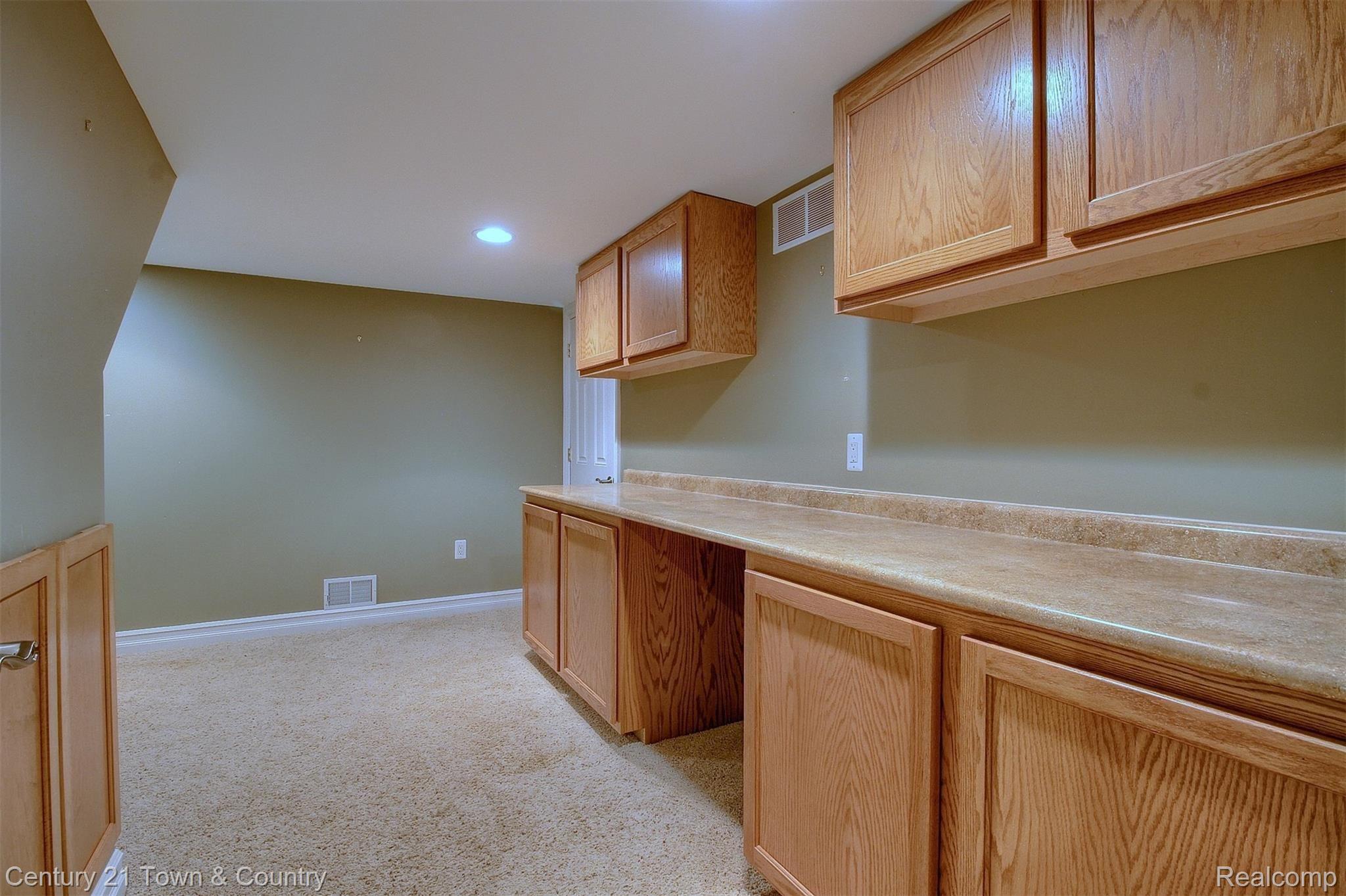 4210 Derry Court Rochester, MI 48306 - Photo 46 of 65 46-Finished Lower Level Cabinets.jpg